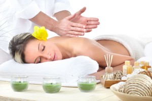 woman receiving a massage to represent Lotus Touch Citrus Body Polish
