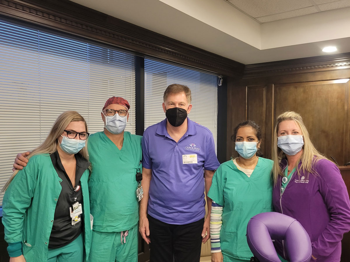 corporate-chair-massage-medical-center medical professionals pictured with Ricky in office
