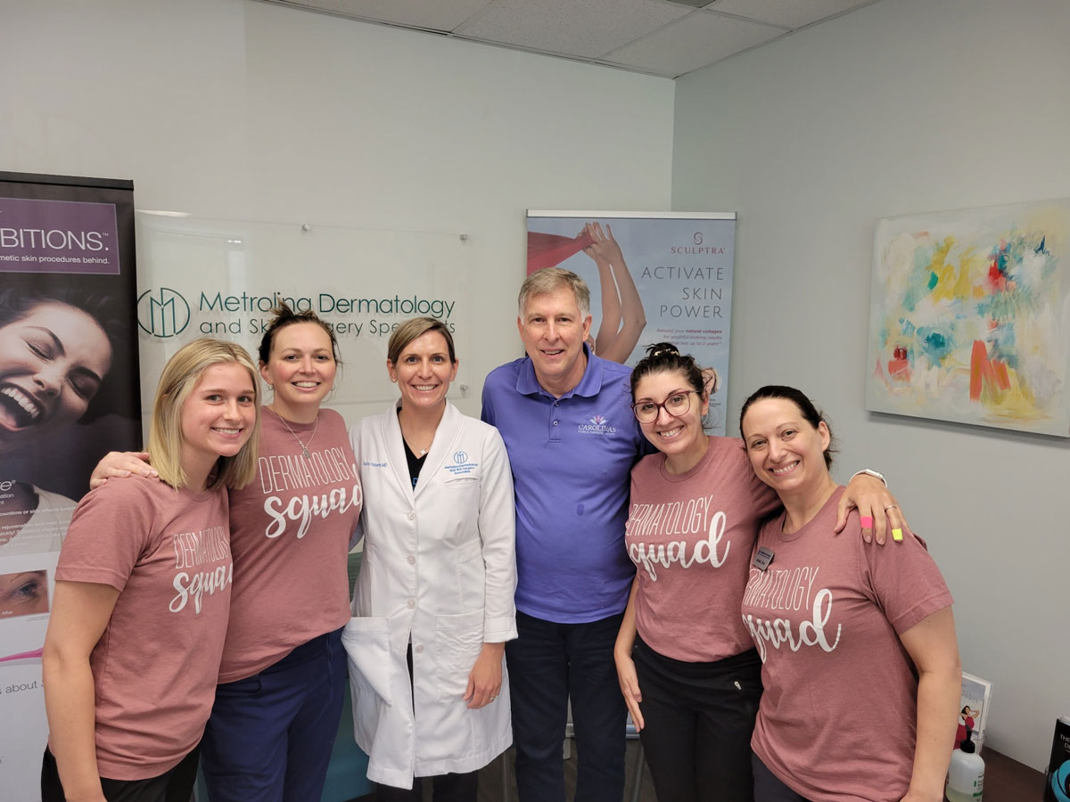 dermatology-office-staff Ricky pictured with dermatologist staff